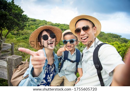 happy asian Family On Hiking Adventure and taking selfie