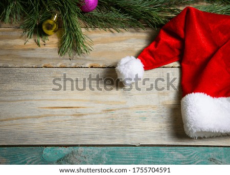 Christmas background with red santa hat under copy space