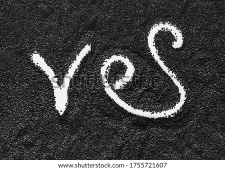 The inscription "Yes" is made of black sesame.