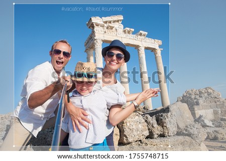 Happy family making a selfie photo using a samrtphone and Selfie stick on summer vacation in Turkey, Side, Manavgat with Temple of Apollo ruines on background. Family traveling concept image.