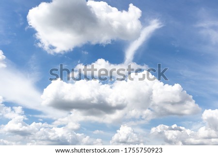 Beautiful blue clear sky with white clouds background in sunny day and copy space. Nature bright sky background image. Summer blue sky. Texture for Design. Natural cloudy Wallpaper.
