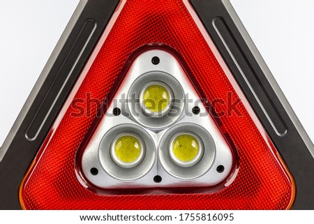 Multifunctional cob working lamp. Portable Flood Lamp COB Work Light Triangle Warning Light SOS Searchlight Emergency Warning Traffic Light Spotlight Rechargeable isolated on white background.