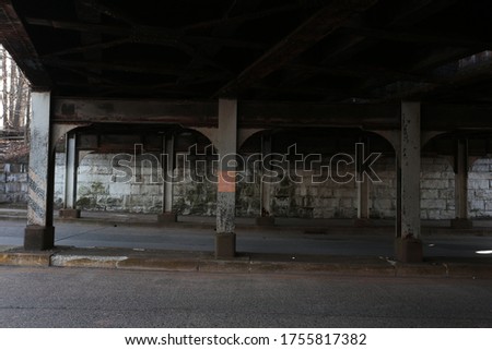 A bridge in an urban low income area of NJ.  Royalty-Free Stock Photo #1755817382
