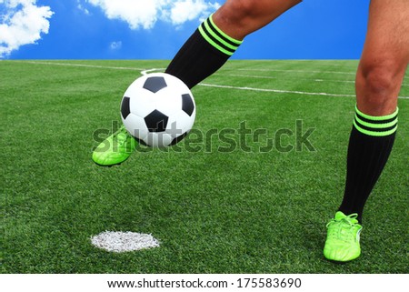 kicking soccer ball