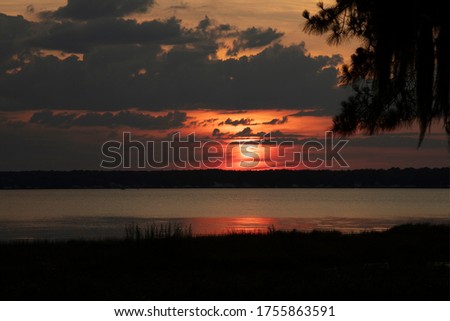 Sunset over Kingsley Lake Starke Florida Royalty-Free Stock Photo #1755863591