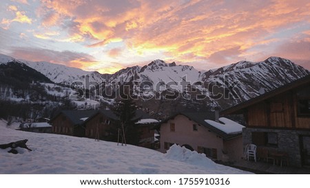 Sunset over the snowy mountains 