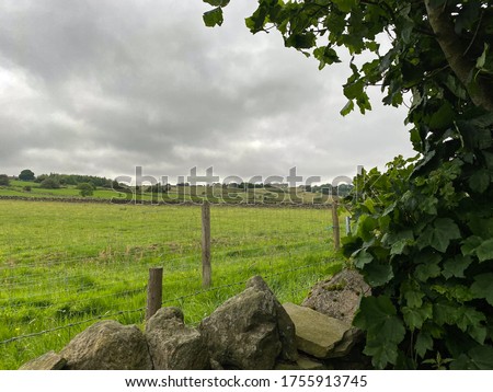 Heavy rain clouds over a meadow in, Allerton, Bradford, UK