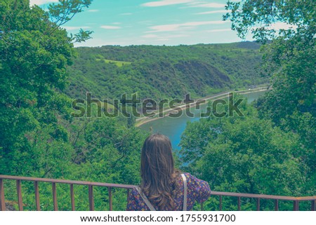 Summer sunny lifestyle fashion portrait of young stylish hipster woman walking in mountains, wearing cute trendy outfit, smiling enjoy weekends, travel with backpack. awesome water, river sea view 