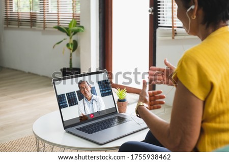 Asian senior video call with doctor telemedicine telehealth concept Royalty-Free Stock Photo #1755938462
