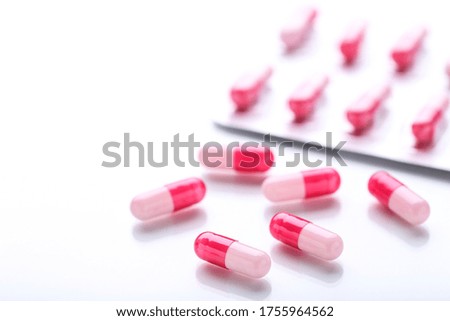 Pills and blisters on white background