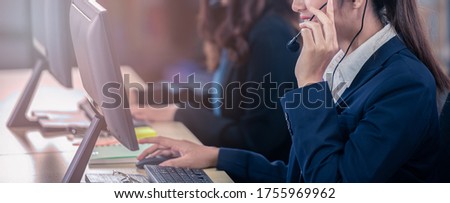 Business online call center operator for help, service support, assistance team, learning, training with headset microphone ready for service. Royalty-Free Stock Photo #1755969962