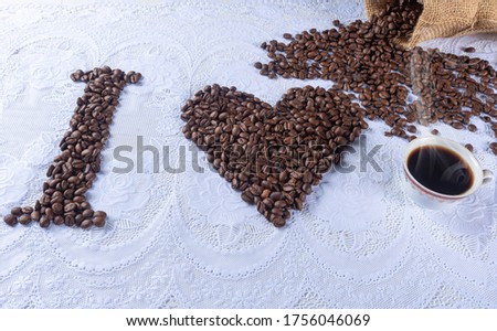 
coffee beans forming drawings and phrases for those who love coffee
