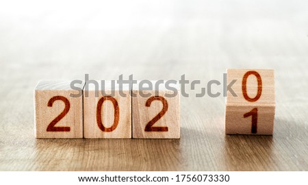concept of change in the new year. wooden blocks with the inscription 2020 change to the inscription 2021
