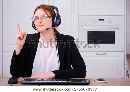 Camera view an woman in online video conference. Business woman in when working remotely in the home kitchen, concept work in coronavirus epidemic