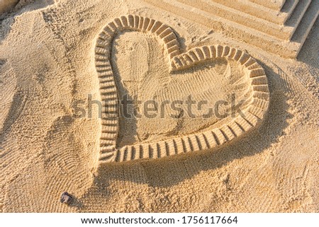 Love heart on beach romantic emotion on nature background