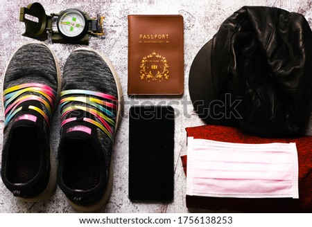 A flatlay picture of travelling concept during covid-19 outbreak. Many country starts to open their tourism industry as to boost their economy.