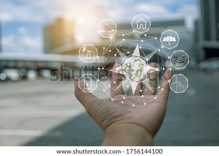 Technology, hand holding with environment Icons over the Network connection on green background.