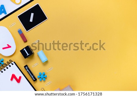Notepad and notebooks with stationery. Golden, white, pink and black stationery back to school concept. 