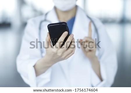 Doctor using smartphone. Concept of healthcare and medical, communication.
