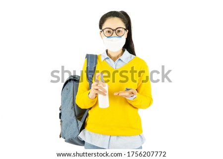 Young asian student woman in glasses wearing medical face mask,carrying a bag to go to school Under the outbreak of the virus isolated on white background Royalty-Free Stock Photo #1756207772