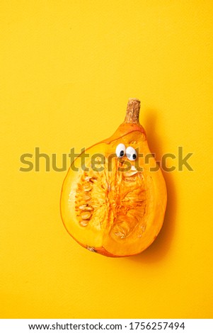 funny pumpkin on the orange background