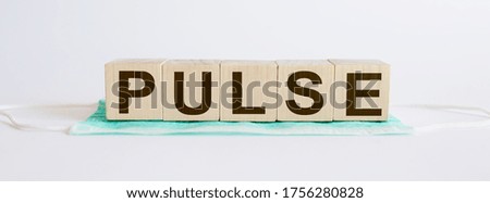 PULSE medicine words on the wooden block.Healthcare conceptual for hospital, clinic and medical busines