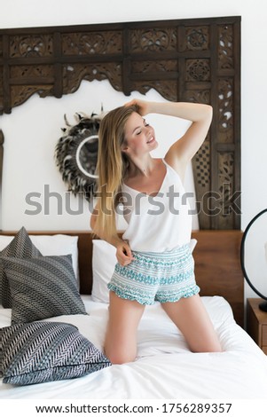 Portrait of funny comic girl enjoying good morning holding raised arms
