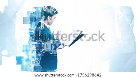 Side view of thoughtful young businessman with clipboard with double exposure of abstract blurry cityscape. Concept of leadership and paperwork. Toned image