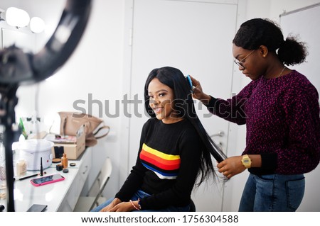 African American woman applying hairdresser or hairstylist at beauty saloon. Royalty-Free Stock Photo #1756304588