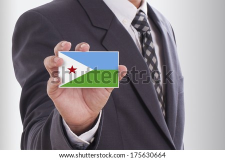 Businessman in suit holding a business card with Djibouti Flag 