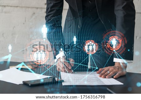 Businessman in suit signs contract. Double exposure with social media and planet hologram. Man signing agreement on research. People network concept.