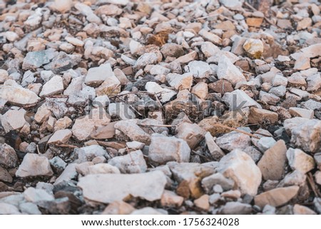 Gray gravel, crushed stone close-up, front view. Photos with low depth of field. High quality photo