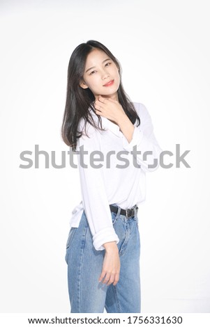 a beautiful Asian woman in white tops and jeans