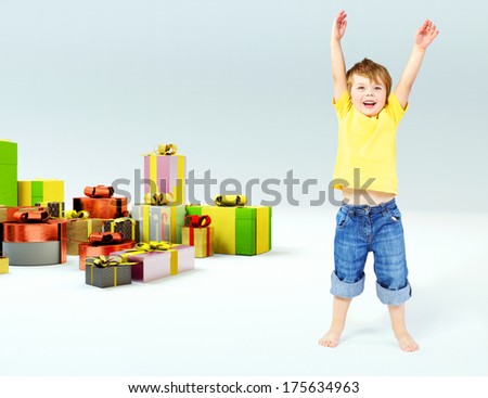 Happy boy with many gift boxes