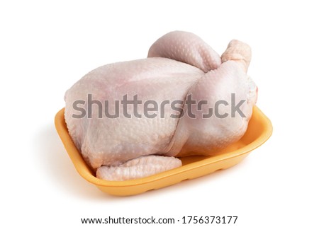 Whole raw chicken carcass on a shopping tray isolated on a white background with clipping paths with shadow and without shadow
