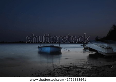 A lonely boat after a day fishing in the lagoon