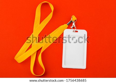 Work ID name tag. The ID of the employee. Card icons with ropes on a red background