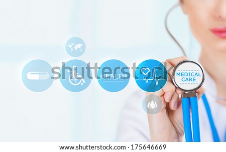 Medicine doctor hand holding stethoscope and working with modern medical icons