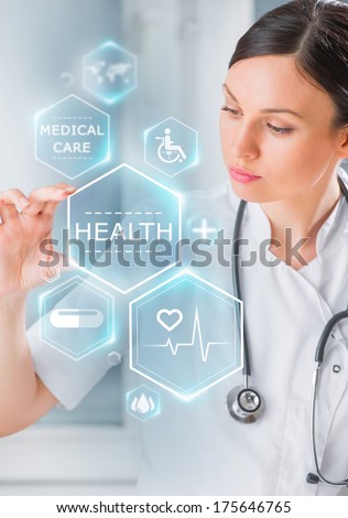Female medical doctor working with healthcare icons. Modern medical technologies concept