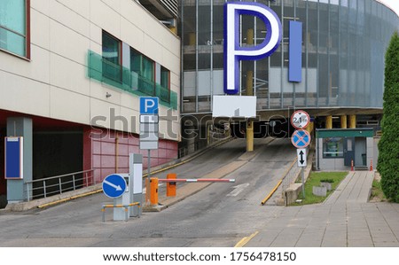 Modern multi-level car city parking. Msass production buildings