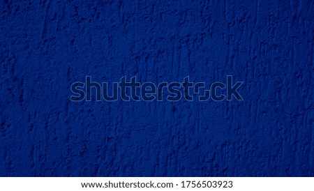 Blank navy blue cement plaster texture surface of wall background