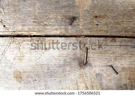 background old wooden Board with nails close up