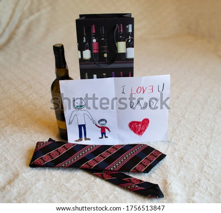 Happy fathers day greeting card with writing I love U you Daddy, red heart and drawing father and child holding hands wearing face mask, bottle and gift bag, red striped dark tie as presents