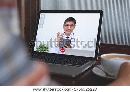 Telemedicine, telehealth, medical online, E health concept.  Asian doctor giving health consultation by video calling, online meeting app on laptop computer to client on video health channel Royalty-Free Stock Photo #1756525229