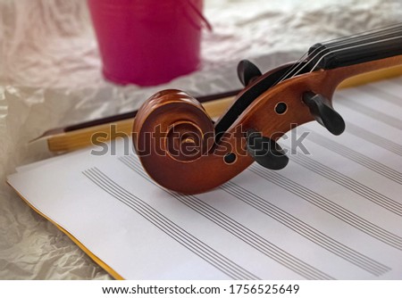 Closeup Scroll of violin put on background,part of acoustic instrument,blurry light around
