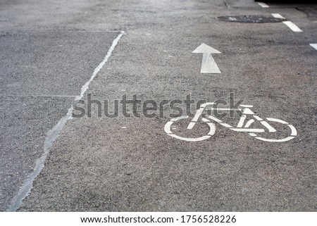 Street sign for Bicycle route painted on the road surface