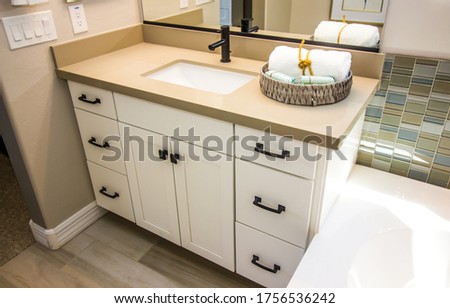 Modern Bathroom Vanity Cabinet With Decorator Basket Royalty-Free Stock Photo #1756536242