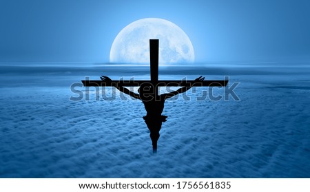 Jesus on the cross over th clouds with full moon -"Elements of this image furnished by NASA"