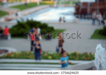 Blurred background. Recreation of people in the city Park. Leisure in the city.