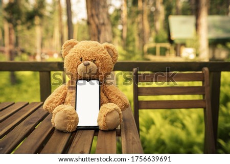 teddy bear with phone. mock up phone image